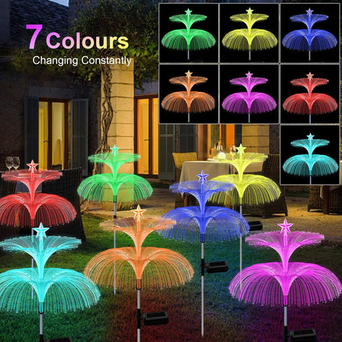 Solar Star Jellyfish Garden Lights Six Pack With Color Changing Fiber Optic Glow for outdoor yard and garden decor at night.