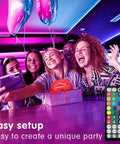 Group of friends enjoying Music Sync LED Light Strips 100ft Dual 50ft Rolls with App and Remote RGB Color Changing in party decor.