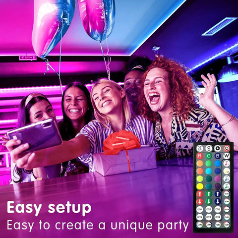 Group of friends enjoying Music Sync LED Light Strips 100ft Dual 50ft Rolls with App and Remote RGB Color Changing in party decor.