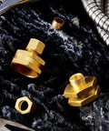 Two Pack Heavy Duty Brass Garden Hose Adapters Set Three Eighths To Three Quarters Of An Inch Female To Female Swivel Compression For Outdoor Watering Car Washing And Garden Irrigation. Brass fittings on dark stone