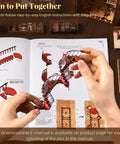 Hands assembling DIY Miniature Book Nook Kit With 3D Wooden Puzzle, LED Light Bookend Insert For Bookshelf Decor