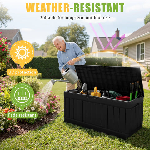 Man using 82 Gallon Outdoor Storage Box With Lid for Patio to store garden tools in black, UV resistant design and lockable feature.