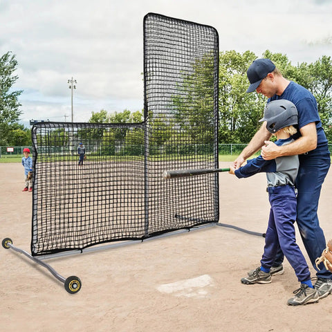 Coach teaching young player in front of L Screen Baseball Pitching Net With Wheels, 7x7 Ft Heavy Duty Portable Steel Frame for training.