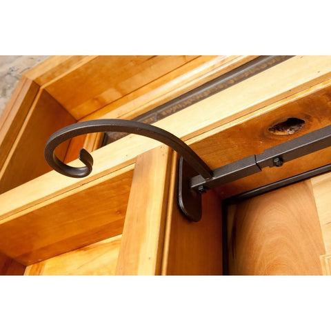 No Sweat Setup Front Door Garland Hanger With Thick Rubber Padded Ends For Year Round Decor Fits Wide Doorjambs No Drill Needed Holds Twenty Pounds Like A Champ Straight Up Heavy Duty Steel hanging over a wooden doorframe.