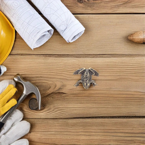 Toad Shaped Brass Cabinet Drawer Pulls For Vintage Style Retro Hardware For Kitchen, surrounded by tools on wood surface