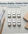 Six Pack Nylon Guide Wheels In Clean White For Furniture Track Systems And Drawer Hardware on a concrete surface with tools.