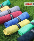 Eight colorful microfiber towels including Microfiber Golf Towel 16 By 16 Inches With Carabiner Clip Waffle Pattern on grass.