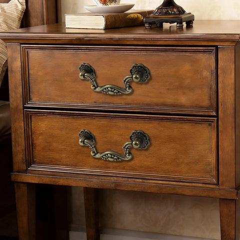 Vintage Drop Bail Cabinet Pulls 3 Inch Hole Centers 6 Piece Set Antique Bronze Finish on wooden dresser drawers.