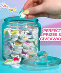 25 Piece Mini Eraser Set With Cute Cartoon Characters Like Banana Cactus Frog And More in a jar on a desk