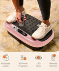 Person adjusting remote on HexaPlate Lite Vibration Plate For Full Body Toning And Recovery With Lymphatic Drainage Compact Vibe Platform