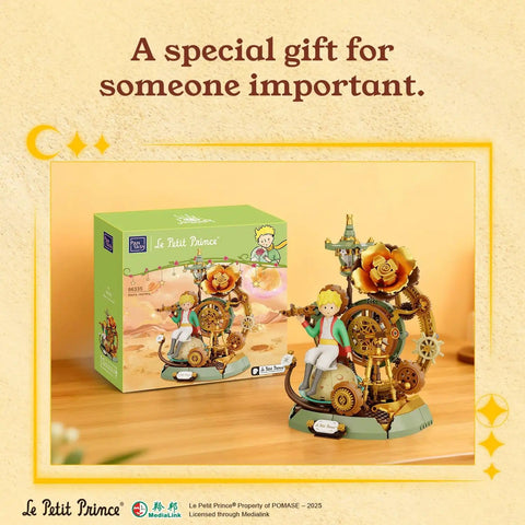 Little Prince Starry Journey Building Set Vintage Mechanical Pocket Watch Inspired Model With Gears Telescope And Golden Rose Collectible Display Toy Featuring Exclusive Prince Figure For Collectors And Display Fans Alike Must Have next to product box.