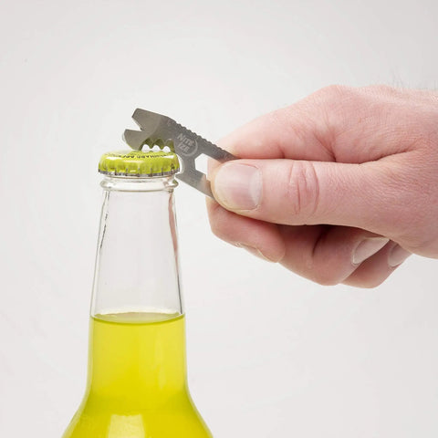 Hand using DoohicKey Keychain Multi Tool Stainless Steel 8 In 1 Bottle Opener to open a bottle