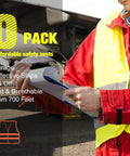 Warehouse worker in red and neon yellow high visibility safety vest with 2 reflective strips, holding clipboard near airplane.