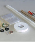 Heavy Duty Commercial Counter Top Chamber Vacuum Sealer With Rotary Oil Pump And Modified Atmosphere Injection components and tools on a table.