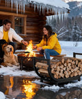 Sturdy Steel Firewood Rack For Indoor And Outdoor Use 32 Inch Log Holder beside a couple by a firepit in snow.