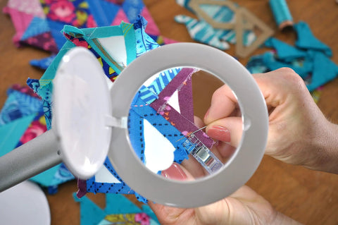 High Visibility Dimmable LED Magnifying Desk Lamp With 2X Lens 5 Dioptre in use for sewing embroidery details up close