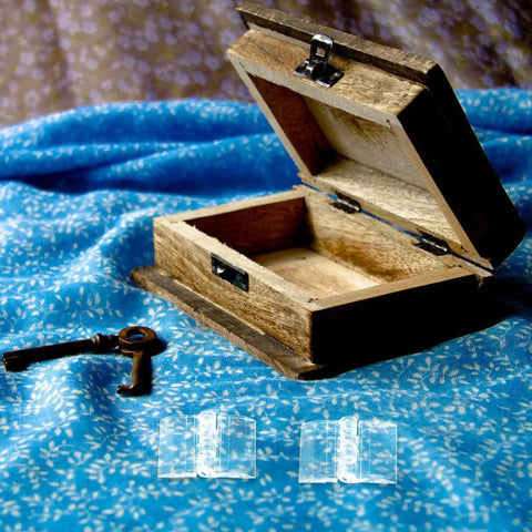 Open wooden jewelry box with metal latch and two acrylic folding hinges on a blue fabric background, 10 Pack Acrylic Folding Hinges For Jewelry Boxes And Display Cases, Heavy Duty Small Cabinet Hinges For DIY Crafts And Storage Solutions, Burr-Free Smooth Safe Hinges With Crystal Clear Finish, Durable And Easy To Install visible.