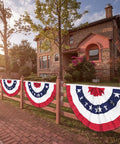 3 Pack Outdoor All American Flag Buntings 1.5x3 Feet on wooden fence by stone house for Memorial Day 4th of July Decor