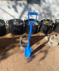 Heavy Duty All Steel Sharpshooter Shovel With Long Handle And Hardened Heat Sharpened Chromoly 15 Inch Head next to potted plants