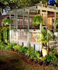 12 Pack 3CCT LED Low Voltage Deck Lights illuminating landscape pathway, black die cast aluminum, frosted glass lens