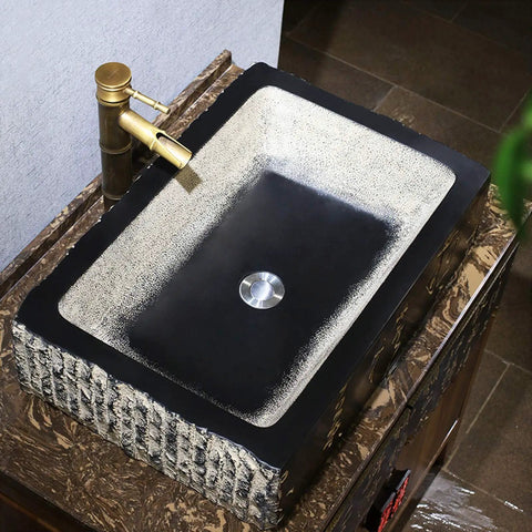 Kickstart Your Top Shelf Bathroom Refresh With This Retro Ceramic Vessel Sink Featuring Imitation Stone Finish And Including Faucet For Single Basin Above Counter Lavatory Vanity Setup, 58x40x15cm black and cream vessel sink with modern faucet.