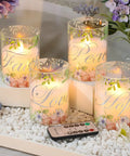 Flameless Real Wax Floral LED Candles With Remote And Timer 4 Pack displaying glow and floral design in glass covers