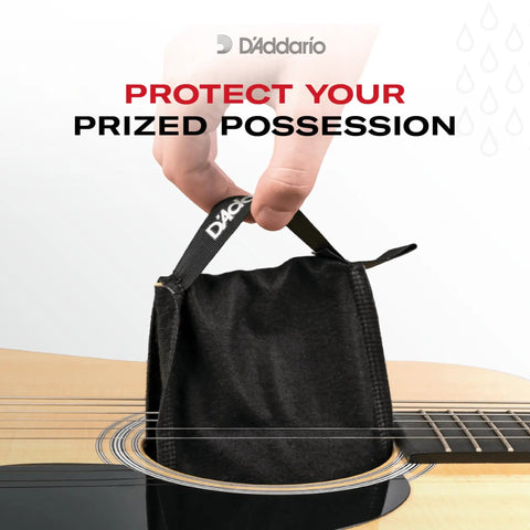 Guitar Humidifier Pack With Two Way Humidification System being installed into guitar case, maintains 45-50% relative humidity range.