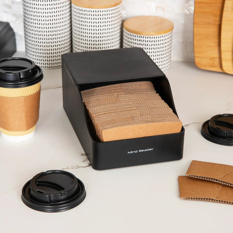 Black hot cup sleeve dispenser for coffee bar and kitchen organization, grab and go space saving coffee station accessory on counter.