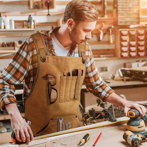 Man wearing Tough As Nails 20 Oz Waxed Canvas Woodworking Apron For Men With 9 Tool Pockets, Water Resistant And Dirt Proof, Khaki