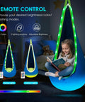 Child reading in a Light Up Pod Swing Seat For Kids With LED Lights, Sensory Hammock Chair in Cotton, blue indoor setup