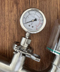 Close-up of Geife 1.5-inch tri-clamp spunding valve with diaphragm pressure gauge in stainless steel