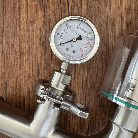 Close-up of Geife 1.5-inch tri-clamp spunding valve with diaphragm pressure gauge in stainless steel