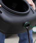 7.3 Quart Oil Drain Pan With Lid Pour Spout And Filter Drain Screen For Automotive Fluids Like Engine Oil Antifreeze Transmission Fluid And More No Mess Spill Free Cleanup For Your Driveway And Garage being used outdoors