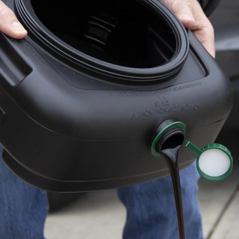 7.3 Quart Oil Drain Pan With Lid Pour Spout And Filter Drain Screen For Automotive Fluids Like Engine Oil Antifreeze Transmission Fluid And More No Mess Spill Free Cleanup For Your Driveway And Garage being used outdoors