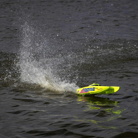 Blackjack 24 Inch V2 Catamaran Brushless RC Boat With Heat Wave Visual RTR speeding on water with splash, two-tone trim