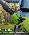 Heavy Duty 24V Brushless Cordless Pole Saw With Eight Inch Guide Bar Cracks Through Thick Limbs And Garden Overhaul Makes Pruning A Total Cinch Includes Rugged Carry Bag For Backyard Titans with greenworks handle and trigger grip.