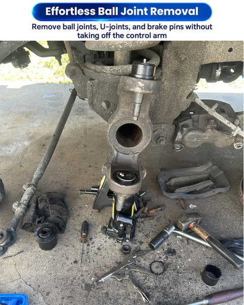 Heavy Duty Ball Joint Press Kit with U Joint Removal Tool on vehicle suspension, tools scattered