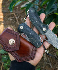 Damascus Steel Pocket Folding Knife With 2.45 Inch Razor Sharp Blade Handmade Craftsmanship Stabilized Wood Handles Cowhide Sheath