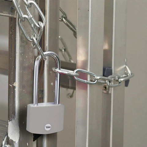 2.2 Inch Long Shackle Covered Aluminum Padlock With 3 Keys securing a gate with chain for outdoor use