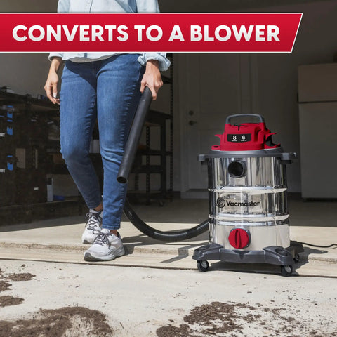 Person using Heavy-Duty 8-Gallon Stainless Steel Wet/Dry Vacuum With Boss-Level Suction in blower mode, outdoor setting