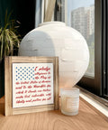 Patriotic Pledge Of Allegiance Wood Sign With Rustic Frame Featuring Blue Stars On White American Flag set on table