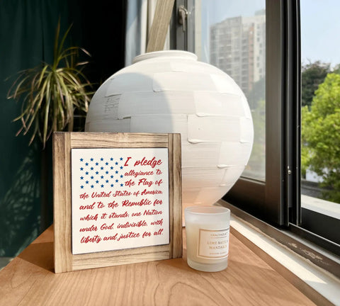 Patriotic Pledge Of Allegiance Wood Sign With Rustic Frame Featuring Blue Stars On White American Flag set on table
