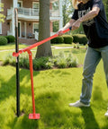 Heavy Duty Beast Steel T Post Puller For Round Posts And Sign Posts, Labor Saving Lever Design, Handles Up To 661 Pounds, Built To Remove Deep Set Wood Posts And Tough Metal Stakes, Tree Stumps, Lifting Chain Not Included, red steel puller removing a round post in a yard