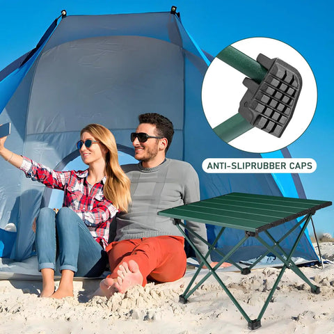 Grab And Go Portable Camping Table With Aluminum Top Foldable Side Table For Outdoor Cooking Hiking And Picnics No Tools Required Quick Setup In A Minute Lightweight And Compact Blackish Green Small on beach with couple and tent