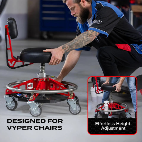 Mechanic adjusting Vyper chair height in garage with under seat tray organizer for EZ Lift chairs, enhancing tool access efficiency.