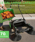 42 Inch Walk Behind Manual Floor Sweeper With 15 Gallon Waste Container And Wide Side Brushes For Garage Warehouse Yard Cleanup Heavy Duty Human Powered Build So You Can Sweep Floors With Zero Sweat Daily, holding leaves.
