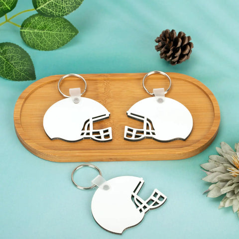 Helmet Shape Sublimation Keychain Blanks Kit, 20 Pieces With Rings And Clips for DIY with two keychains on wooden tray