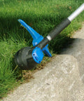 Kobalt 40-Volt Max Trimmer in use on lawn edge, showing spool line attachment for KST 120X, 0.065 inch dual-line design.