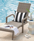 Two Pack Waterproof Outdoor Throw Pillows With Inserts 18x18 Square Cushions For Patio Deck Garden Or Home Furniture Cabana Black All Weather Decor For Sofa Bench And Lounge on a lounge chair by pool.