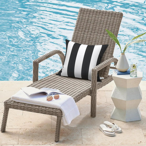 Two Pack Waterproof Outdoor Throw Pillows With Inserts 18x18 Square Cushions For Patio Deck Garden Or Home Furniture Cabana Black All Weather Decor For Sofa Bench And Lounge on a lounge chair by pool.